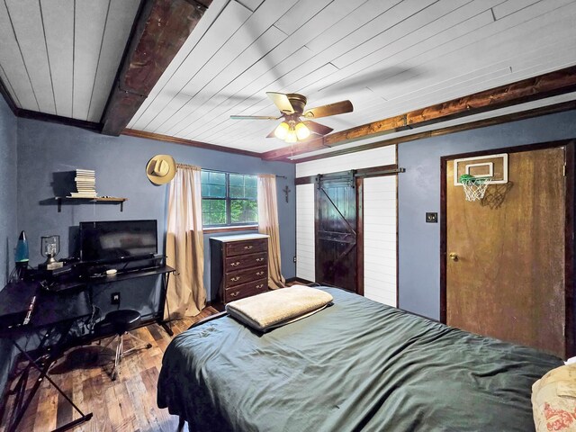 9378 Cocklebur Loop, Silsbee, TX 77656 - bedroom featuring wood-type flooring, crown molding, wood ceiling, a barn door, and a ceiling fan