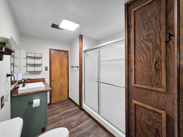 9378 Cocklebur Loop, Silsbee, TX 77656 - bathroom with wood finished floors, a shower stall, and vanity