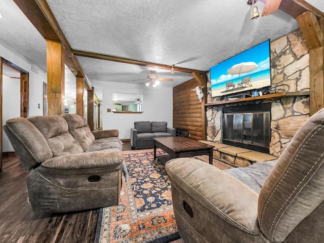 9378 Cocklebur Loop, Silsbee, TX 77656 - living area with wood finished floors, a textured ceiling, ceiling fan, and a fireplace