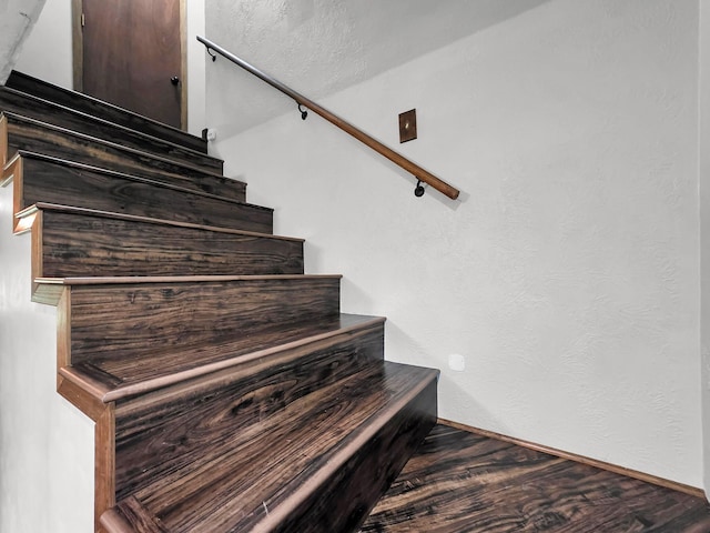 9378 Cocklebur Loop, Silsbee, TX 77656 - stairway featuring wood finished floors and baseboards