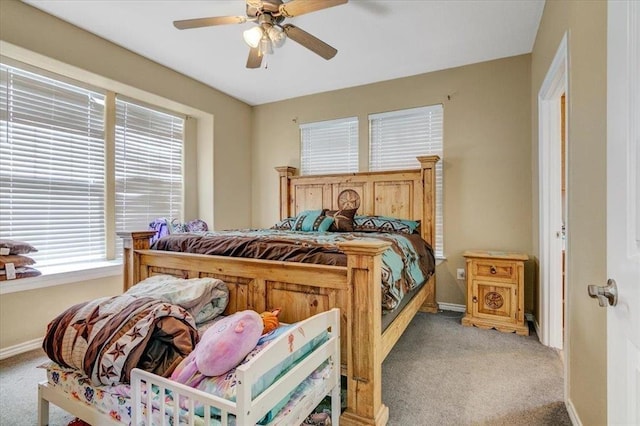 bedroom featuring ceiling fan and light colored carpet