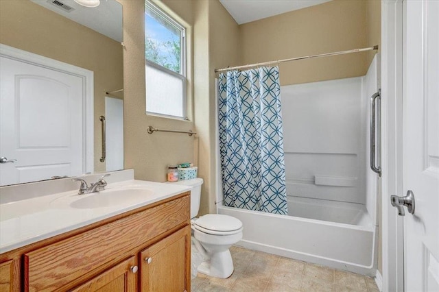 full bathroom with shower / bath combo, vanity, and toilet