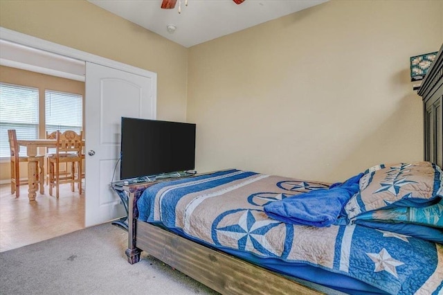 bedroom featuring ceiling fan and carpet floors