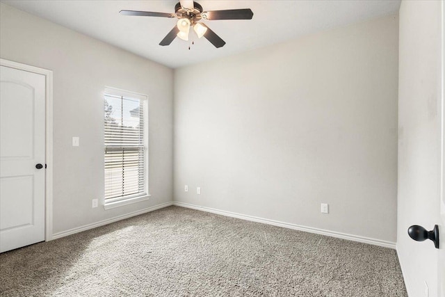 empty room featuring carpet, plenty of natural light, and ceiling fan