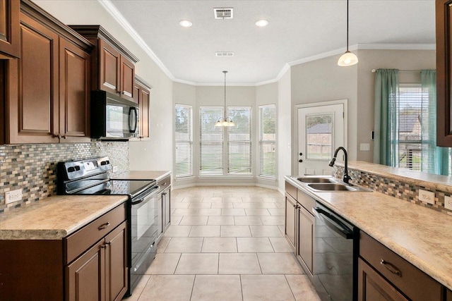 kitchen featuring sink, decorative light fixtures, crown molding, and black appliances