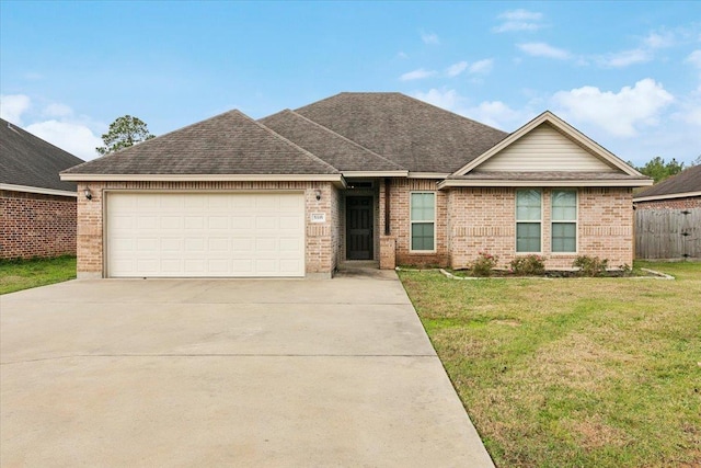 ranch-style home with a garage and a front lawn