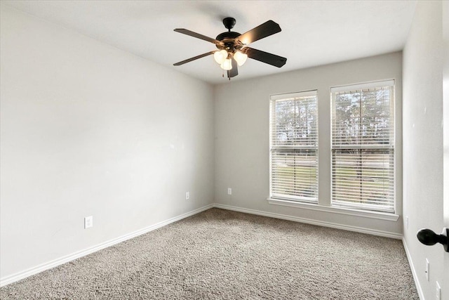 empty room featuring ceiling fan and carpet floors