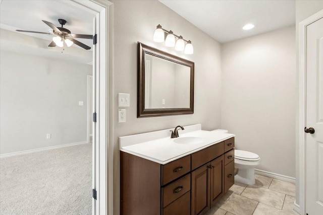 bathroom featuring ceiling fan, tile patterned flooring, vanity, and toilet