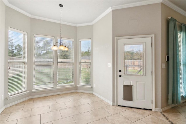 interior space featuring light tile patterned floors, crown molding, and an inviting chandelier