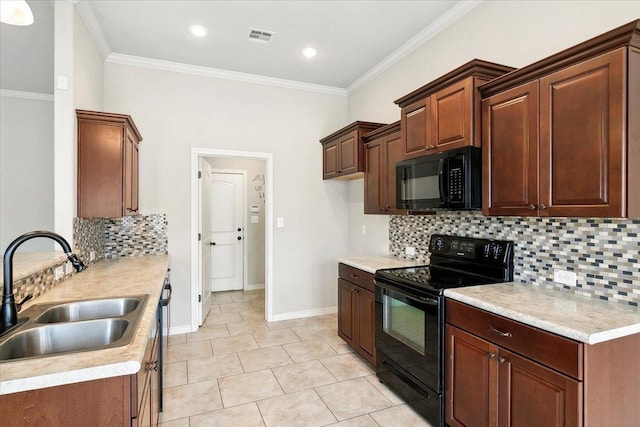 kitchen with light tile patterned floors, sink, ornamental molding, and black appliances