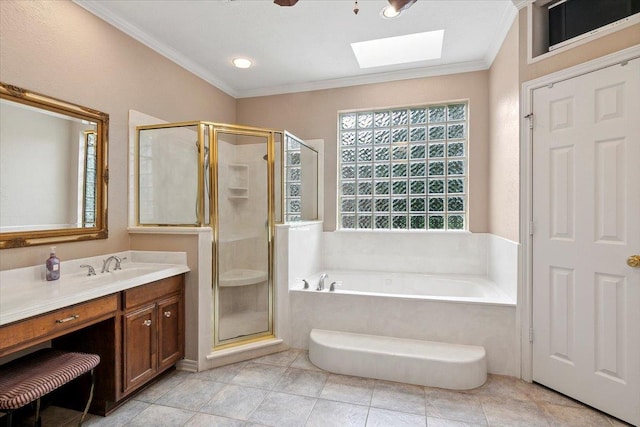 bathroom featuring vanity, ornamental molding, plus walk in shower, and a skylight