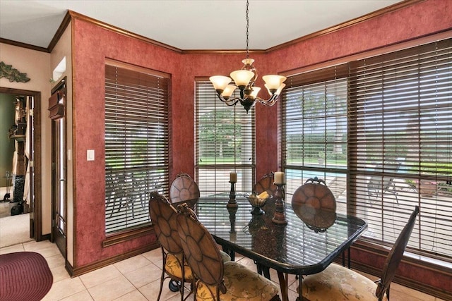 tiled dining area with plenty of natural light, crown molding, and a chandelier