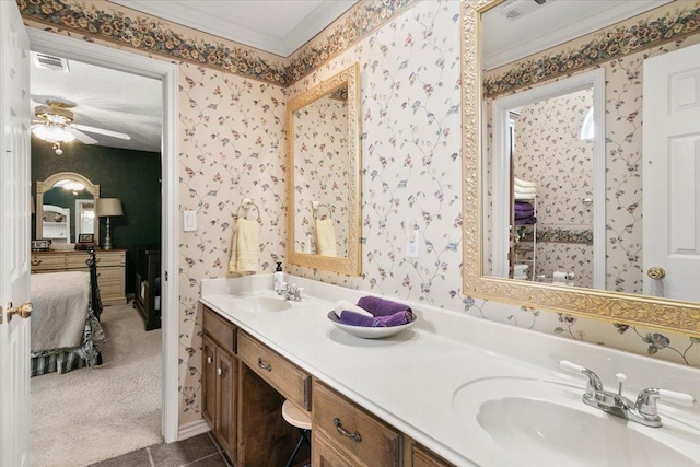 bathroom with tile patterned floors, vanity, ceiling fan, and crown molding