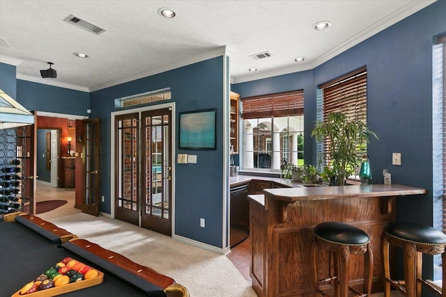 bar featuring dishwasher, light carpet, ornamental molding, and pool table