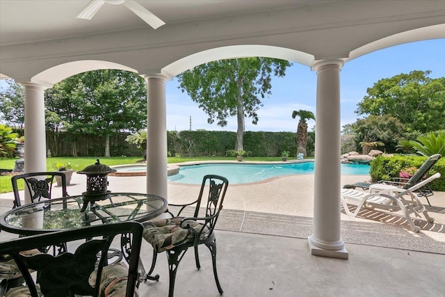 view of pool with ceiling fan and a patio