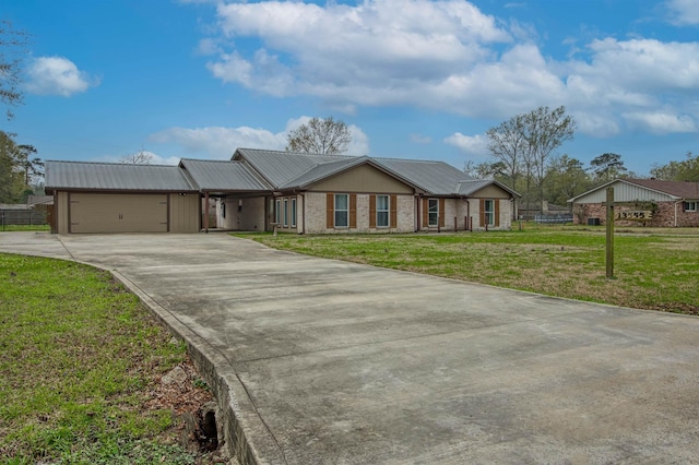 single story home with a garage and a front lawn