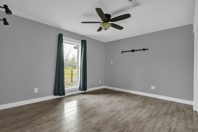 unfurnished room with hardwood / wood-style flooring and ceiling fan