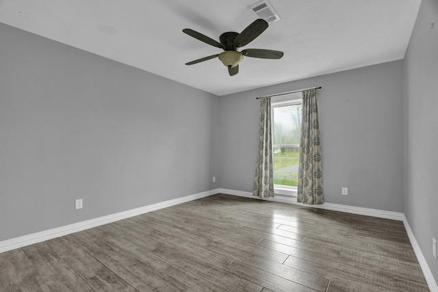 empty room with ceiling fan and wood-type flooring