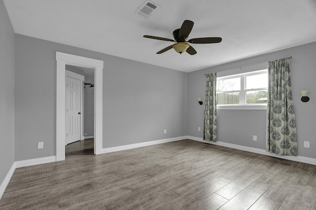 empty room featuring light wood-type flooring and ceiling fan