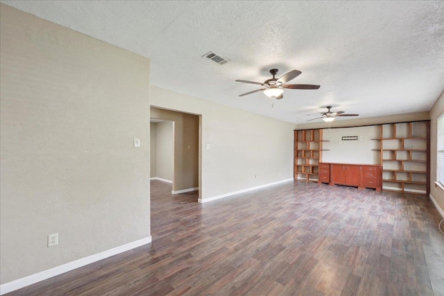275 E Clover Ln, Bridge City, TX 77611 - unfurnished living room with dark wood-style floors, a textured ceiling, ceiling fan, and baseboards
