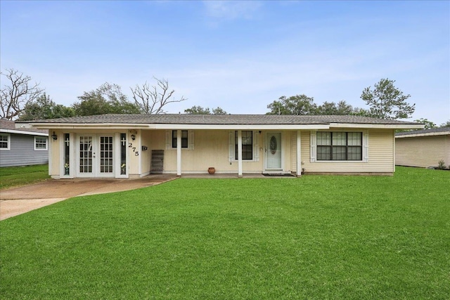 275 E Clover Ln, Bridge City, TX 77611 - ranch-style home with a front yard and french doors