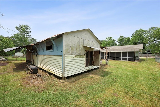 275 E Clover Ln, Bridge City, TX 77611 - view of outdoor structure featuring a sunroom