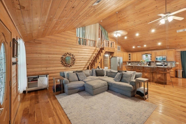 9570 Skeeter Dr, Orange, TX 77632 - living area with wood ceiling, stairway, high vaulted ceiling, ceiling fan, and light wood finished floors