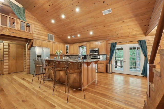 9570 Skeeter Dr, Orange, TX 77632 - kitchen with appliances with stainless steel finishes, french doors, wood ceiling, high vaulted ceiling, and a breakfast bar area