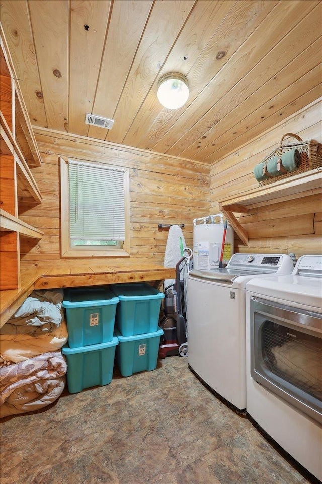 9570 Skeeter Dr, Orange, TX 77632 - laundry area featuring washing machine and dryer, wood ceiling, and wooden walls