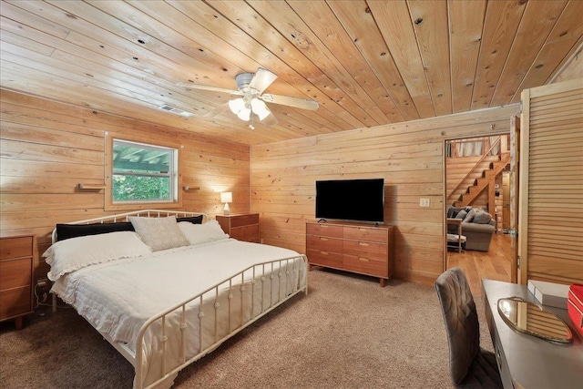 9570 Skeeter Dr, Orange, TX 77632 - bedroom with wood ceiling, wood walls, carpet, and a ceiling fan