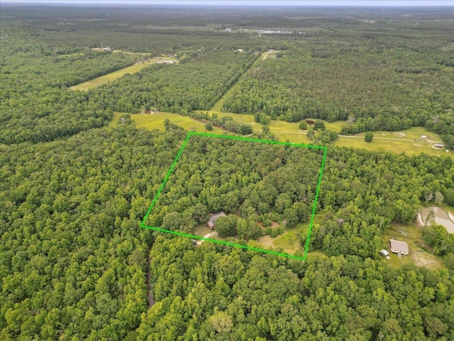 9570 Skeeter Dr, Orange, TX 77632 - aerial view of property's location with a heavily wooded area and property parcel outlined