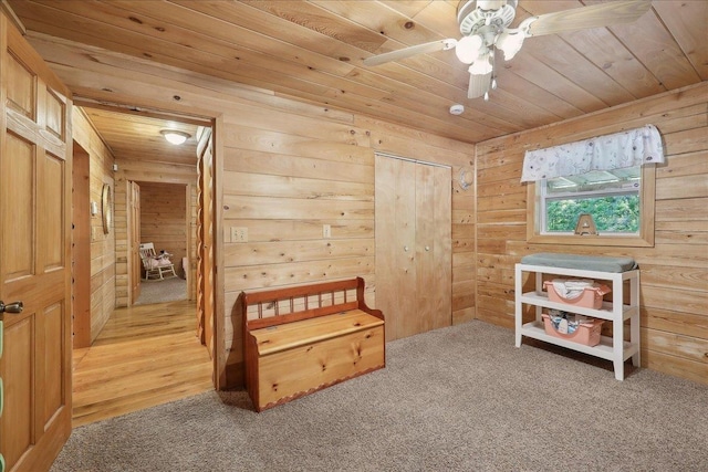 9570 Skeeter Dr, Orange, TX 77632 - bedroom with wood ceiling, wood walls, and light carpet