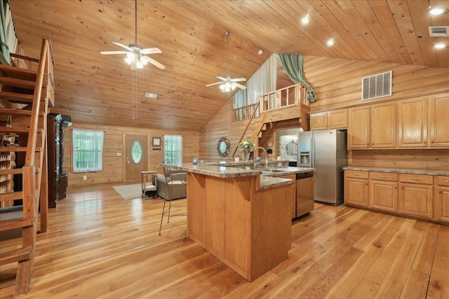 9570 Skeeter Dr, Orange, TX 77632 - kitchen featuring high vaulted ceiling, appliances with stainless steel finishes, a sink, wooden ceiling, and light wood-style floors