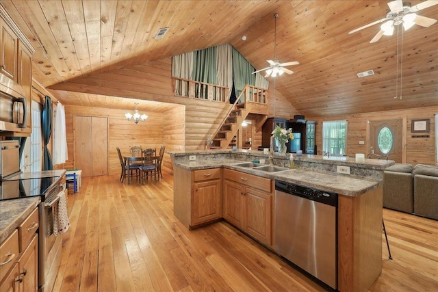 9570 Skeeter Dr, Orange, TX 77632 - kitchen with stainless steel appliances, open floor plan, a sink, ceiling fan, and high vaulted ceiling