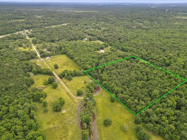 9570 Skeeter Dr, Orange, TX 77632 - view of property location with property boundaries highlighted and a heavily wooded area