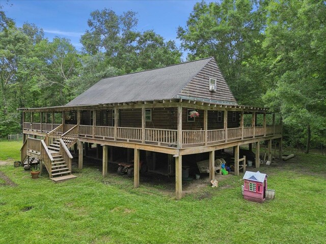 9570 Skeeter Dr, Orange, TX 77632 - rear view of house with a yard, a wooden deck, stairway, and metal roof