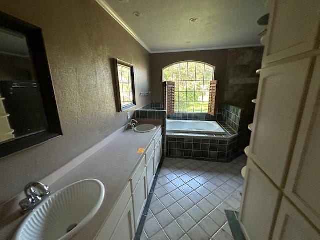 bathroom featuring tile patterned flooring, tiled bath, crown molding, toilet, and vanity