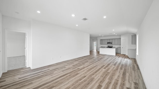 unfurnished living room featuring light wood-type flooring