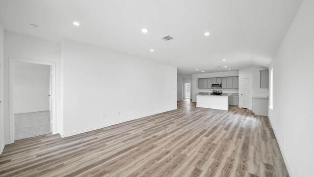 unfurnished living room featuring light wood-type flooring