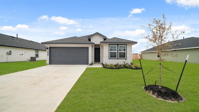 single story home featuring central AC, a front lawn, and a garage