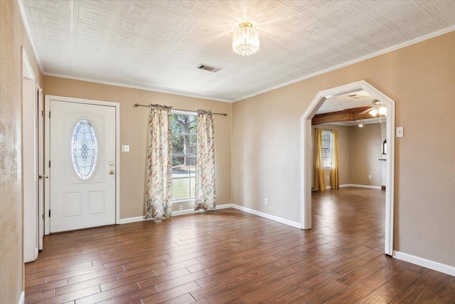 foyer entrance featuring ceiling fan, dark hardwood / wood-style flooring, and ornamental molding