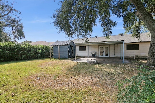 back of house featuring french doors and a yard