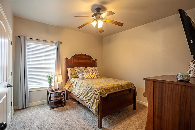 bedroom with ceiling fan and carpet