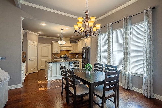 dining room featuring ornamental molding, an inviting chandelier, plenty of natural light, and dark wood-type flooring