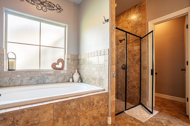 bathroom with shower with separate bathtub