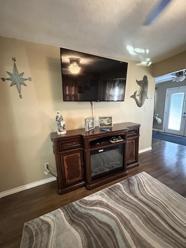 interior space with wood finished floors and baseboards