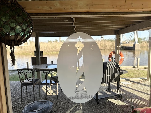 view of patio with a water view