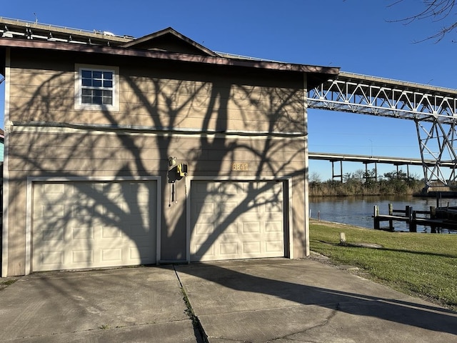 exterior space featuring a water view and driveway