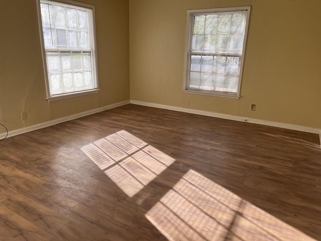 5345 E Parkway Dr, Beaumont, TX 77705 - unfurnished room with baseboards, plenty of natural light, and wood finished floors