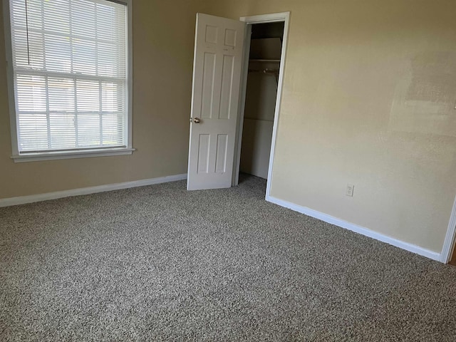 5345 E Parkway Dr, Beaumont, TX 77705 - unfurnished bedroom with a closet, baseboards, and carpet